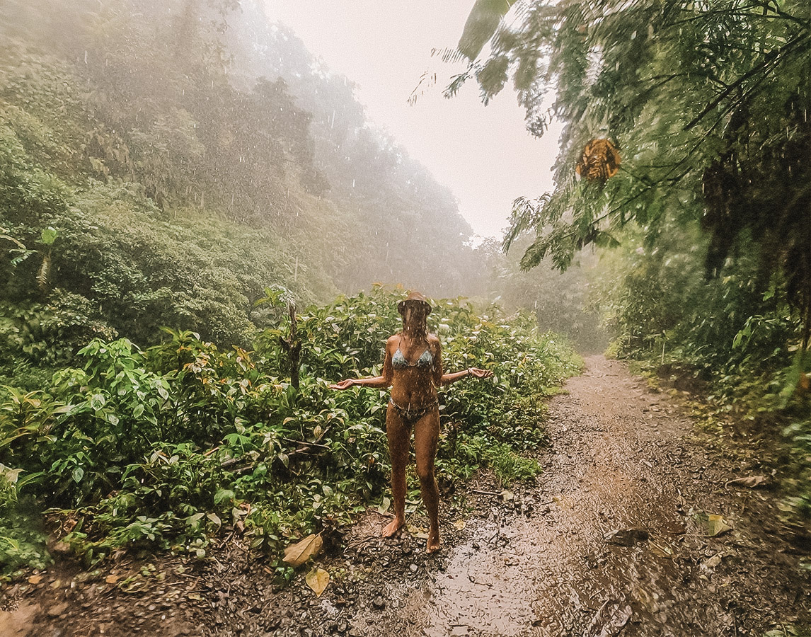 tourist enjoying bali rainy season